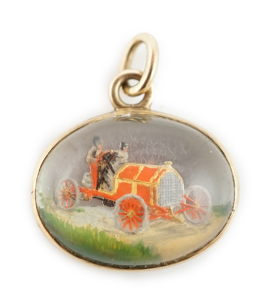 An Edwardian gold and Essex crystal oval fob pendant, commemorating the 1903 Paris-Madrid car race, organised by the Automobile Club de France